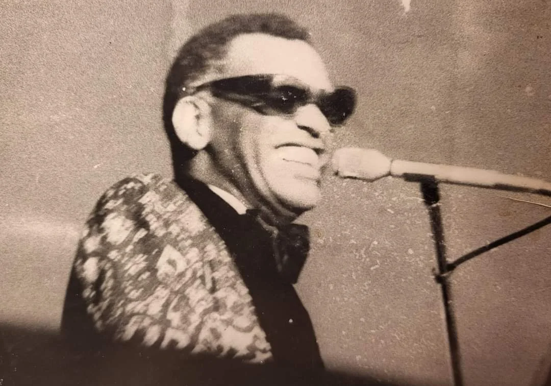 Ray Charles at the microphone, photographed by Kenneth Harris